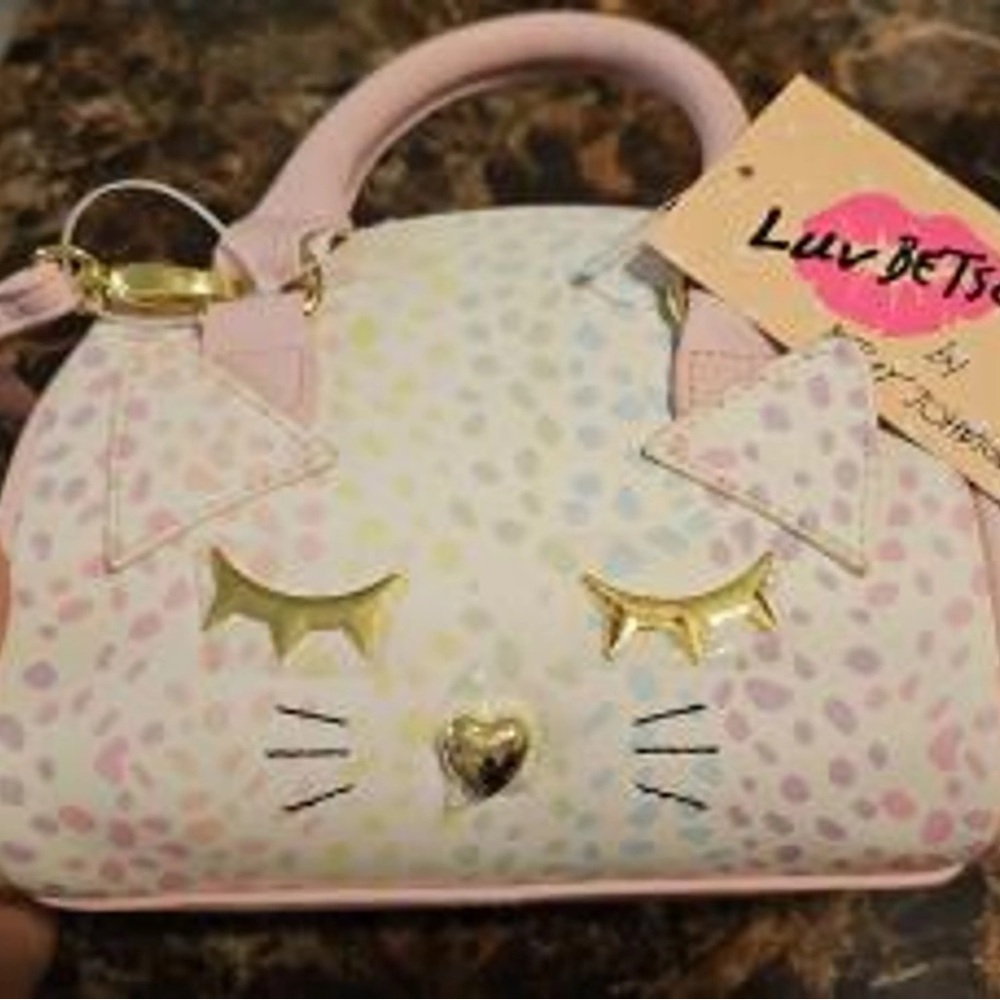 Final Price!!
New Betsey Johnson mini barrel bag